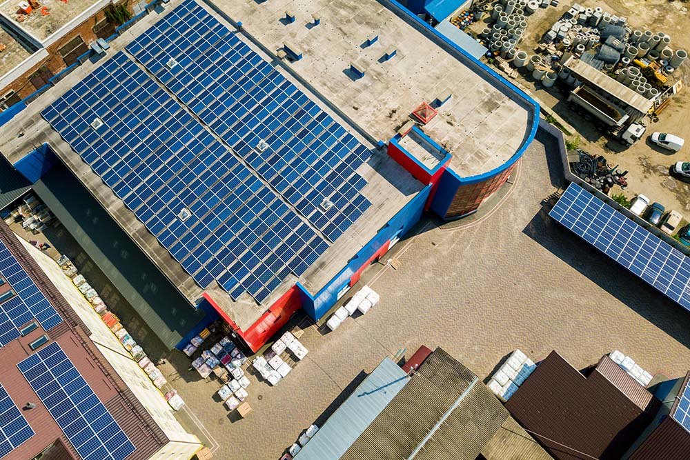 Overhead view of solar panels on a commercial building.