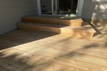 New deck with unfinished light-colored wood